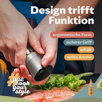 Salz- und Pfeffermühle aus Edelstahl beim Würzen von Speisen in der Küche